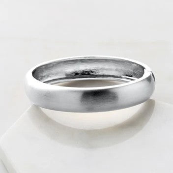 A brushed silver bracelet with a solid pattern