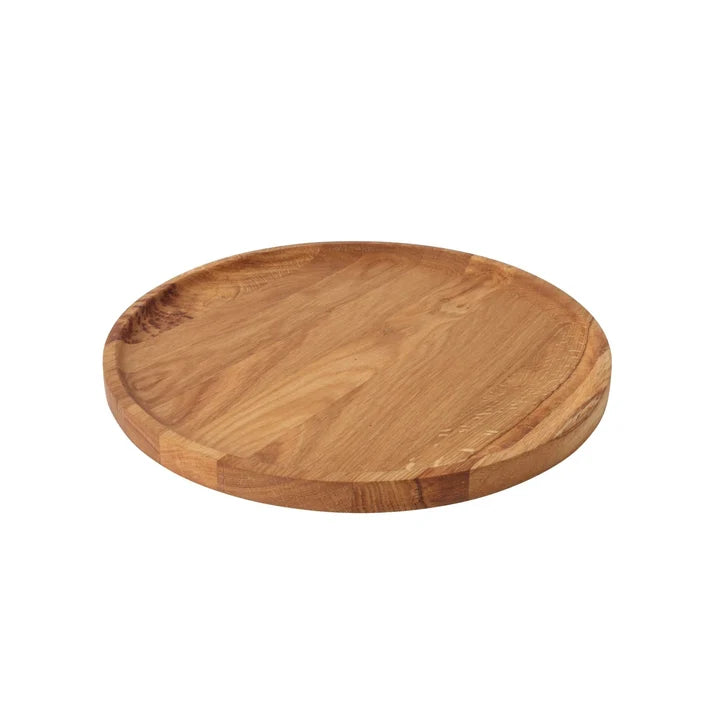 Round wooden cutting board on a white background