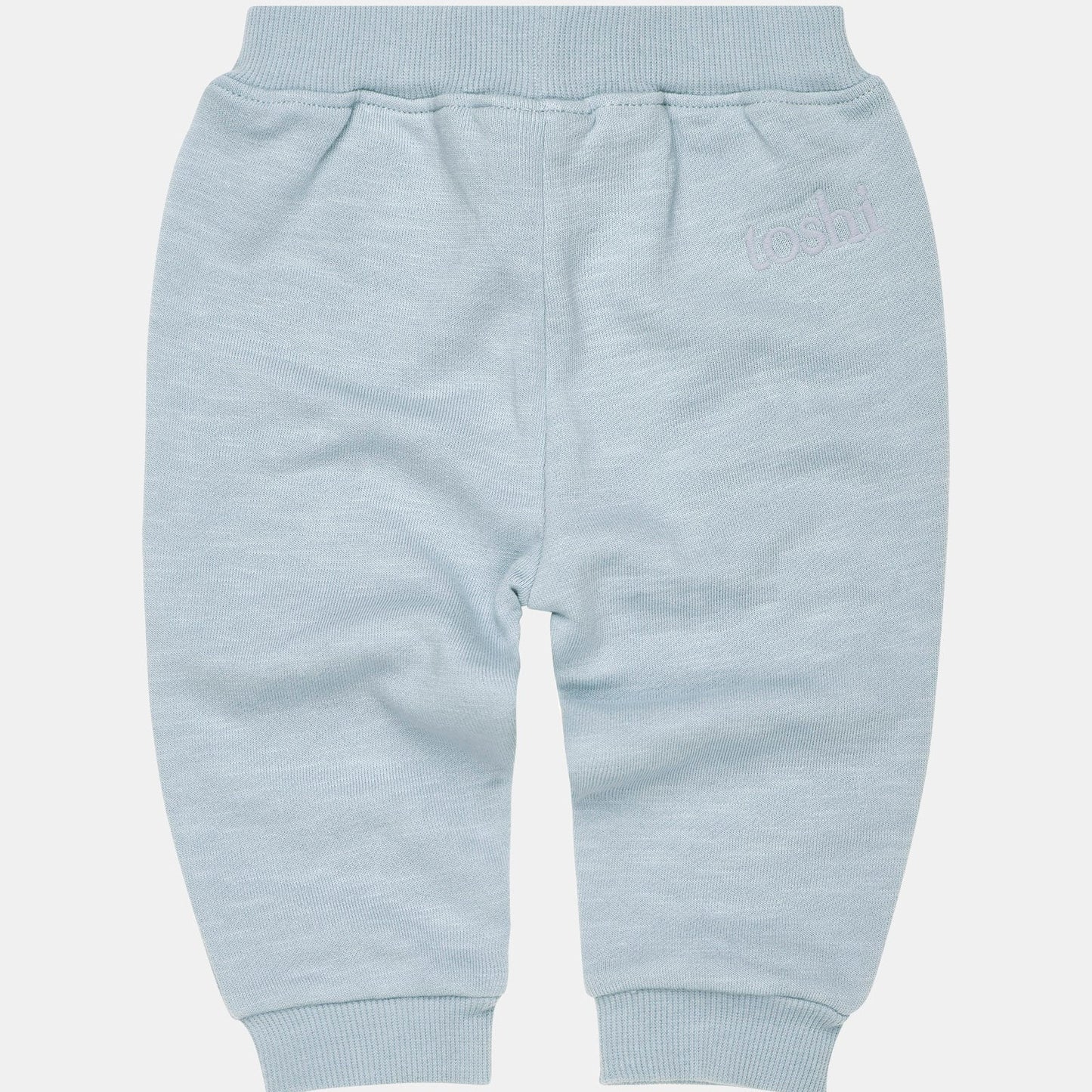 A pair of blue Toshi Dreamtime Organic Sweater and Trackpants for babies, with an elasticized waist and embroidered Toshi logo.