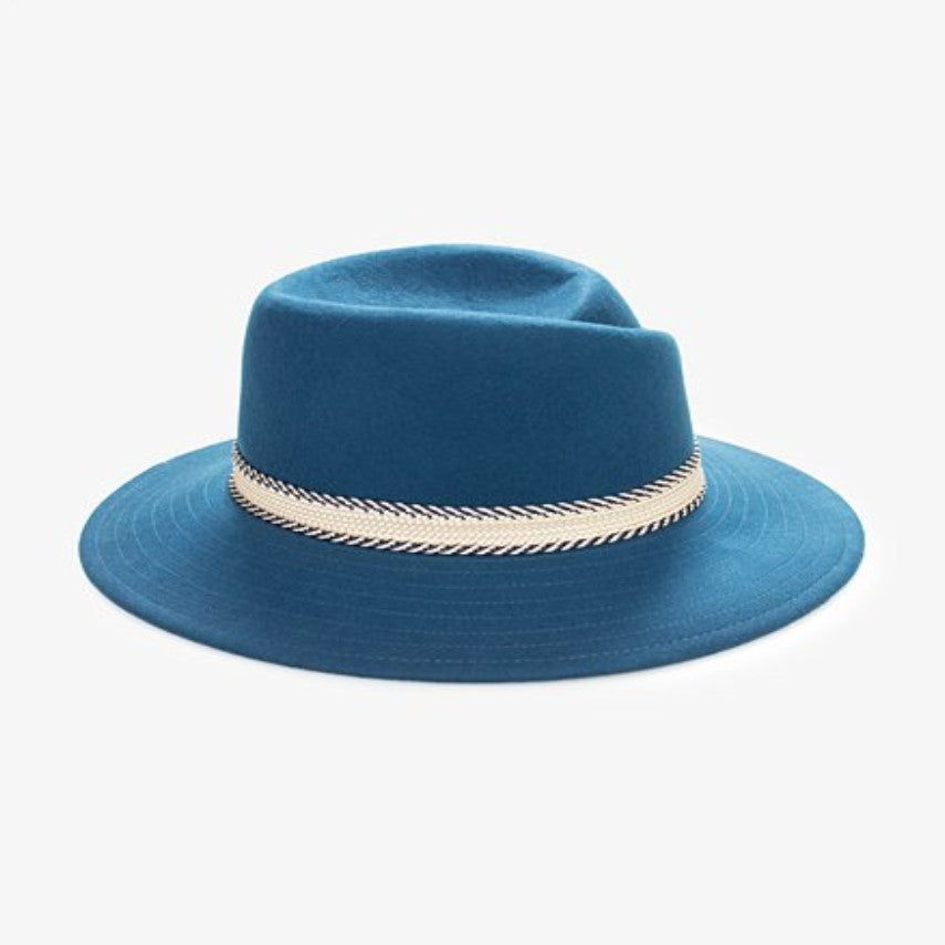 A blue fedora hat with a decorative white band,