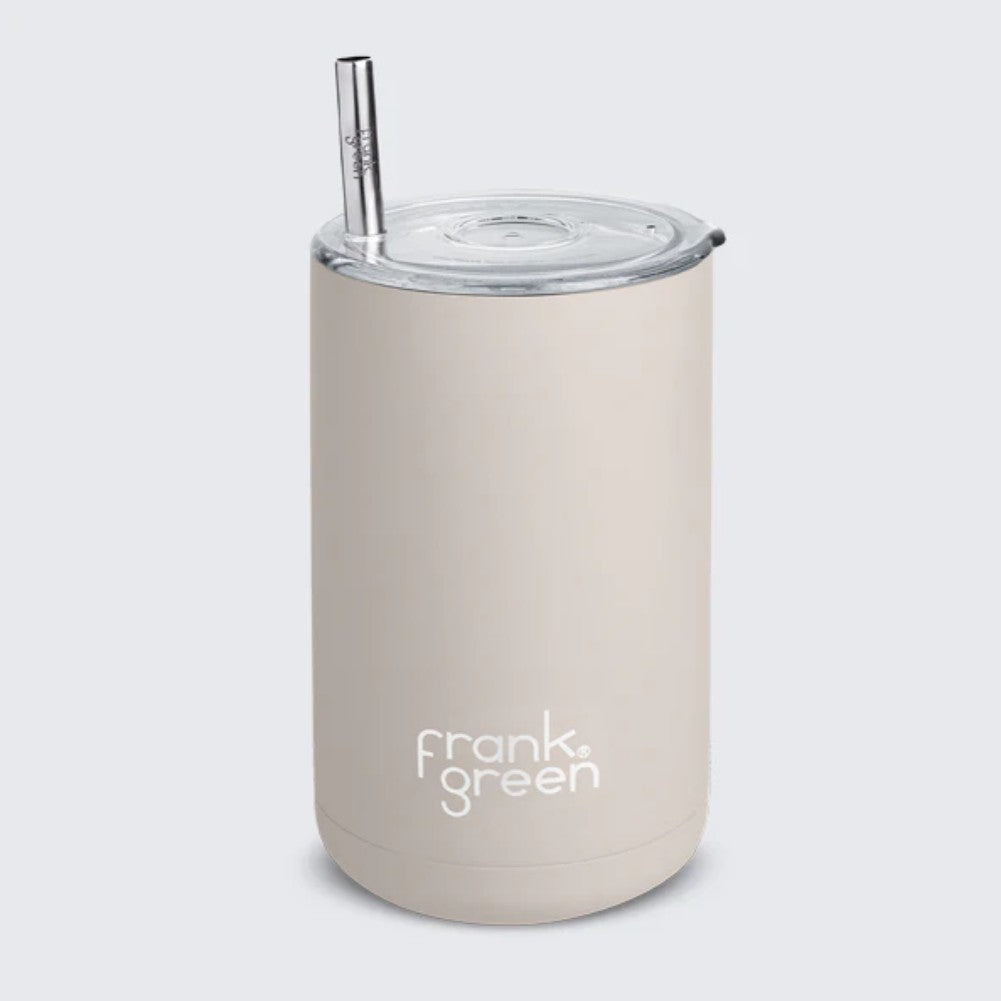 Beige reusable cup with a silver straw on a light gray background