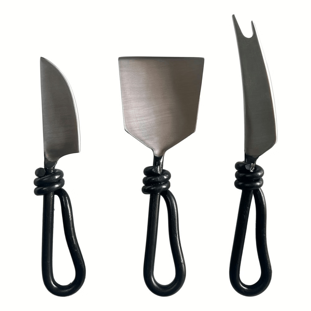 Set of three metal cheese knifes.