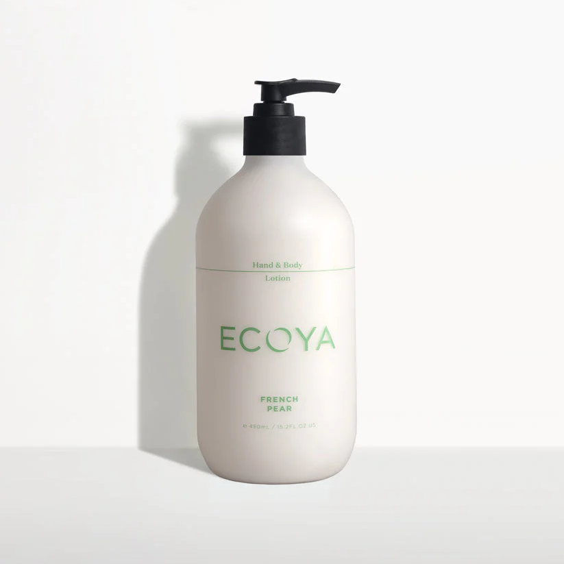 A white pump bottle with green text labeled Ecoya Hand & Body french pear