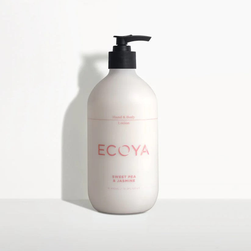 A white pump bottle with pink text labeled Ecoya Hand & Body Sweet Pea.