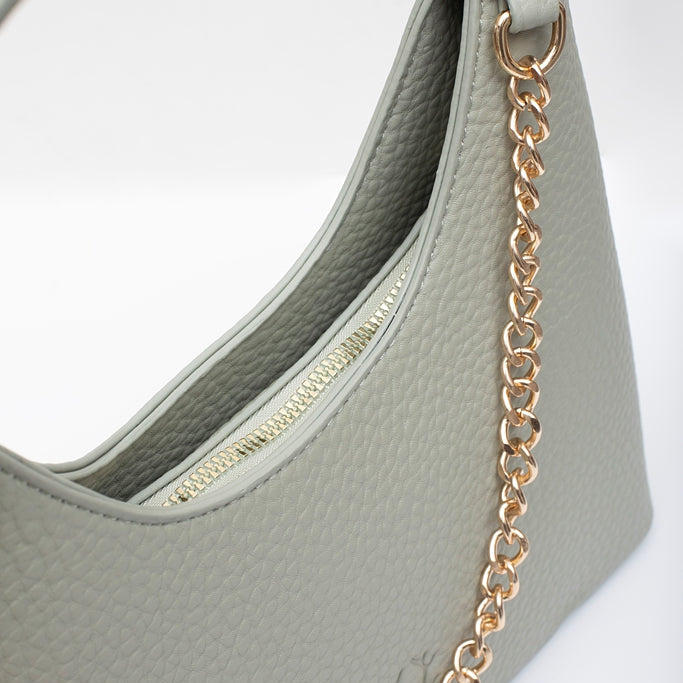 Light gray handbag with a gold chain