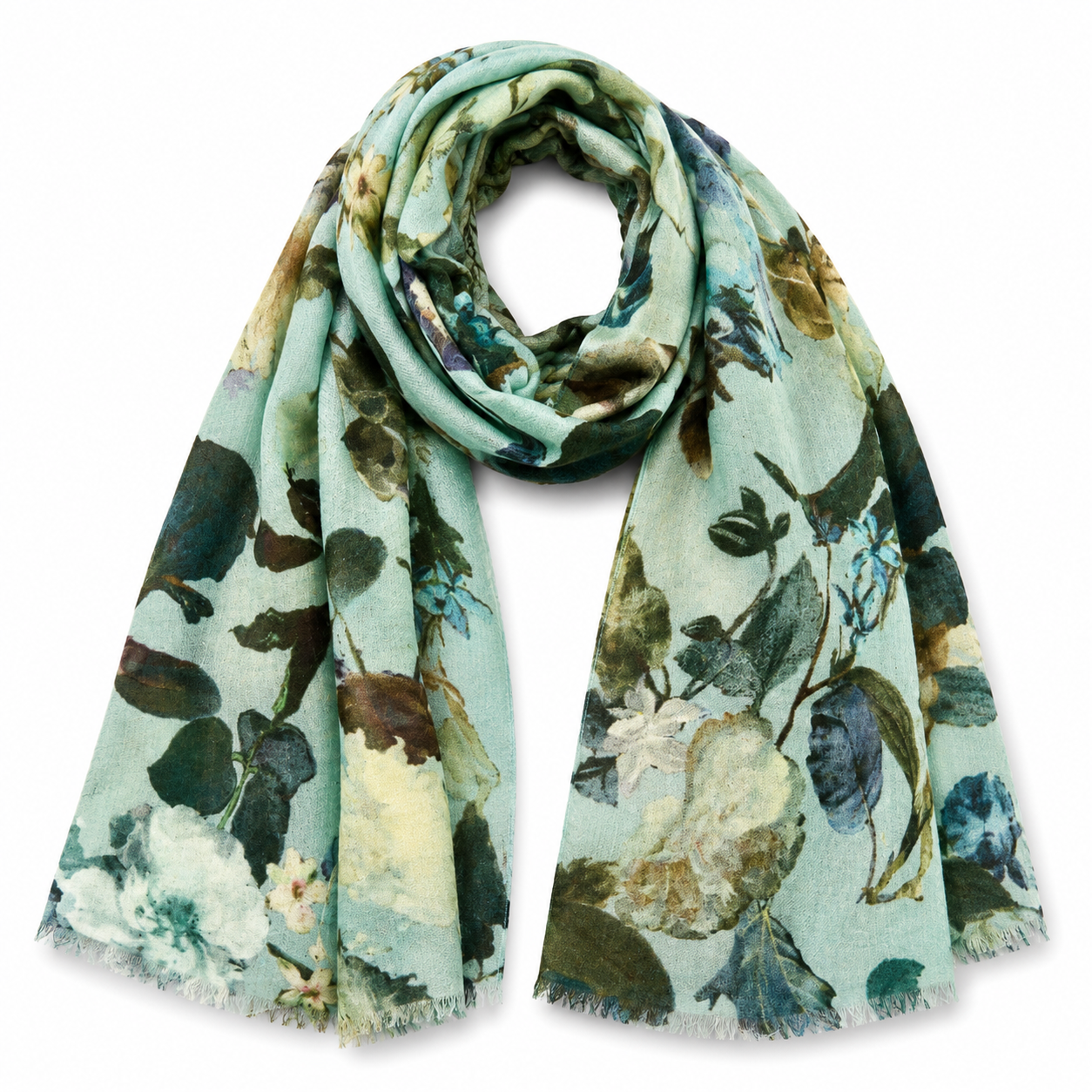 A lightweight Merino Wool Scarf, with a watercolor floral print in shades of mint green, teal, olive green, and cream, finished with fringed edges