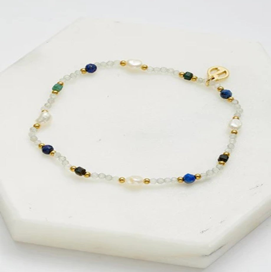 Beaded bracelet with blue, gold, and clear beads