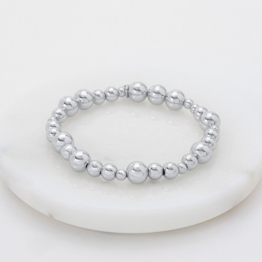 Silver beaded bracelet on a white background
