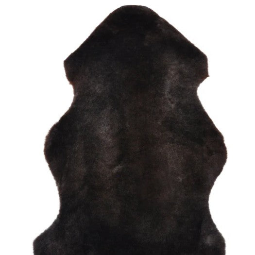 Black sheep skin rug