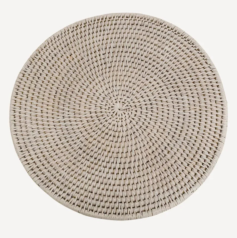 A round rattan white placemat in a natural light beige tone, shown from a top-down perspective on a solid white background.