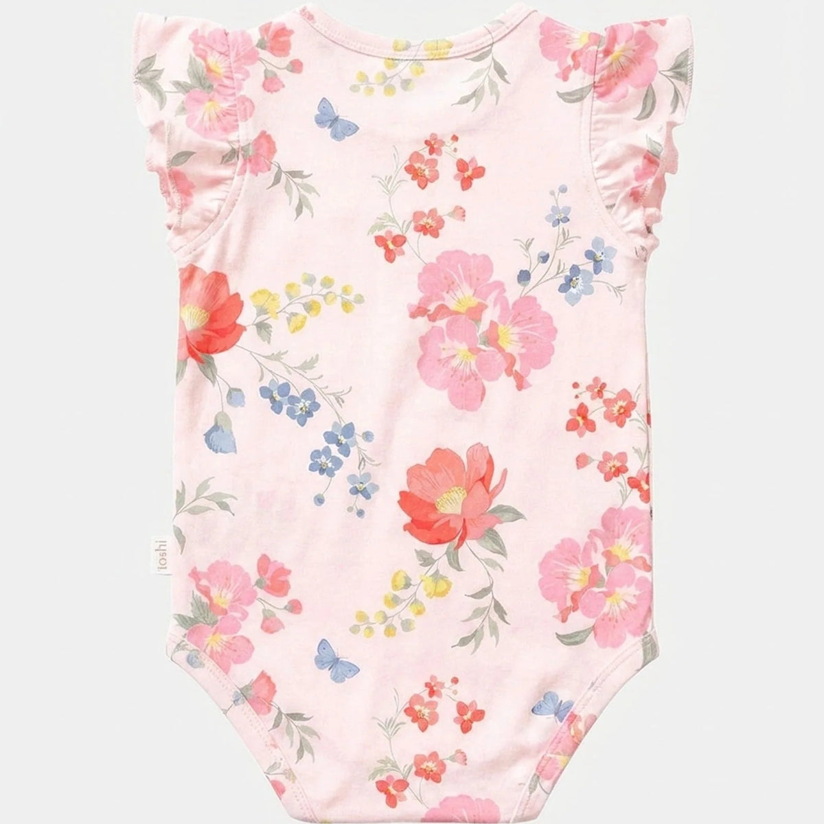A light pink baby bodysuit with a watercolor floral print featuring pink, red, and blue flowers with green leaves and butterflies,