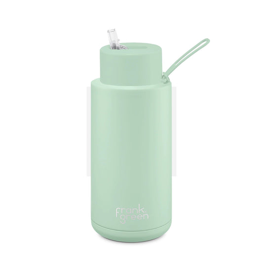 A Frank Green ceramic 1 litre bottle with a straw, in a mint green color.