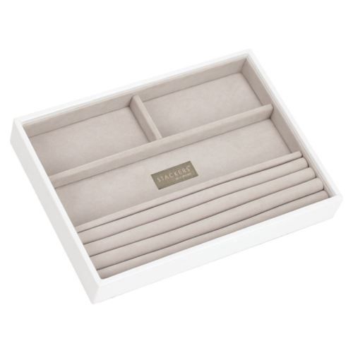 A beige jewellery box with four sections for storing small items like rings and earrings