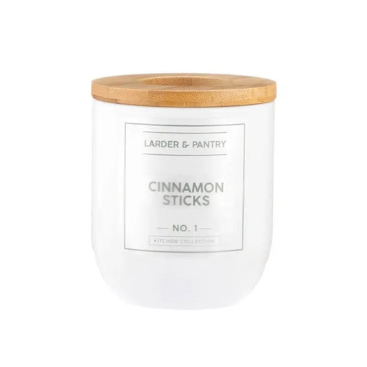 White container with wooden lid labeled 'Cinnamon Sticks' from 'Larder & Pantry'