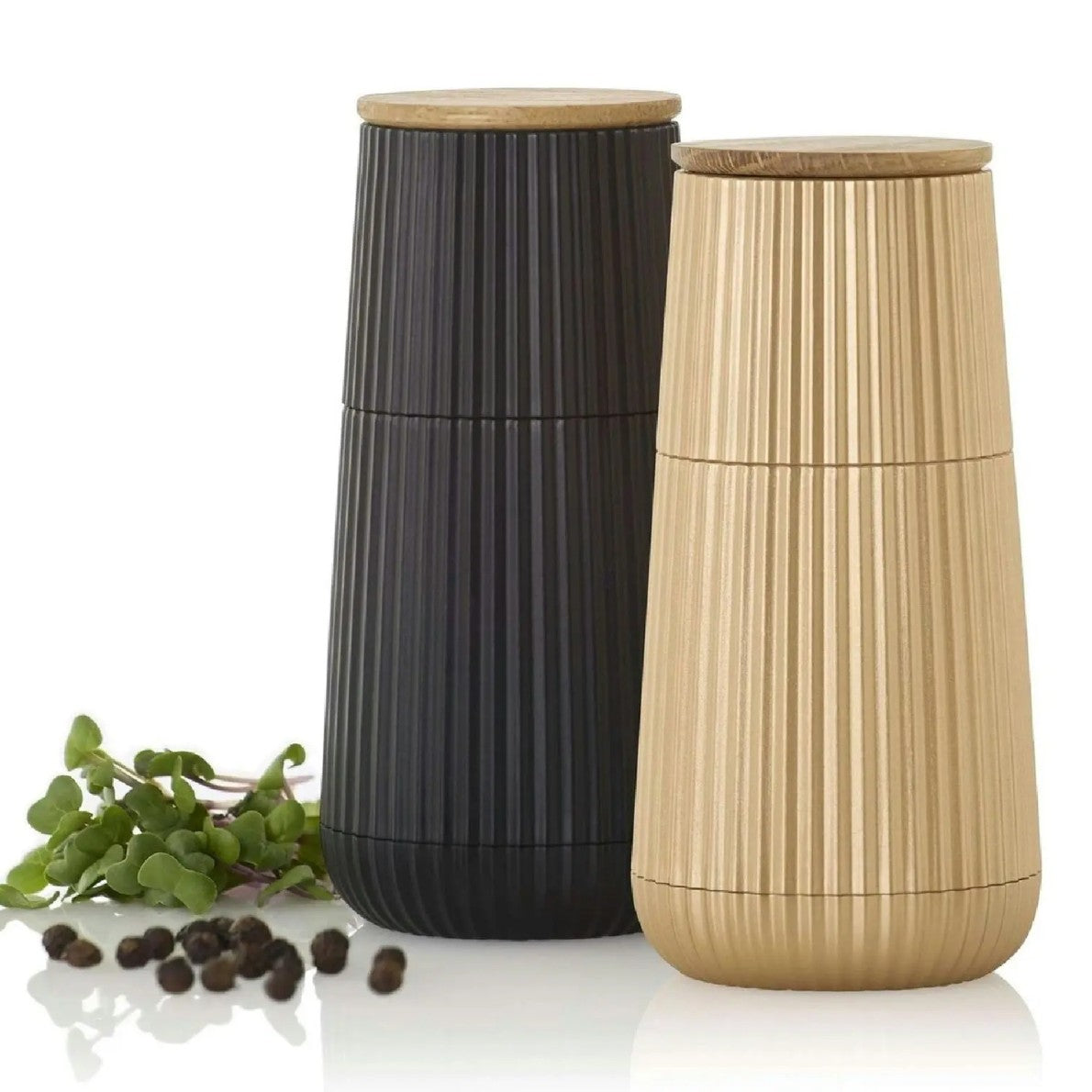 Two pepper grinders, one black and one gold