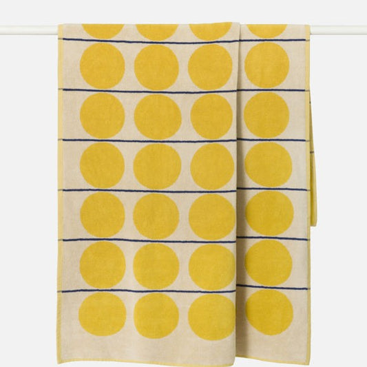 Towel with yellow polka dot pattern on a white background
