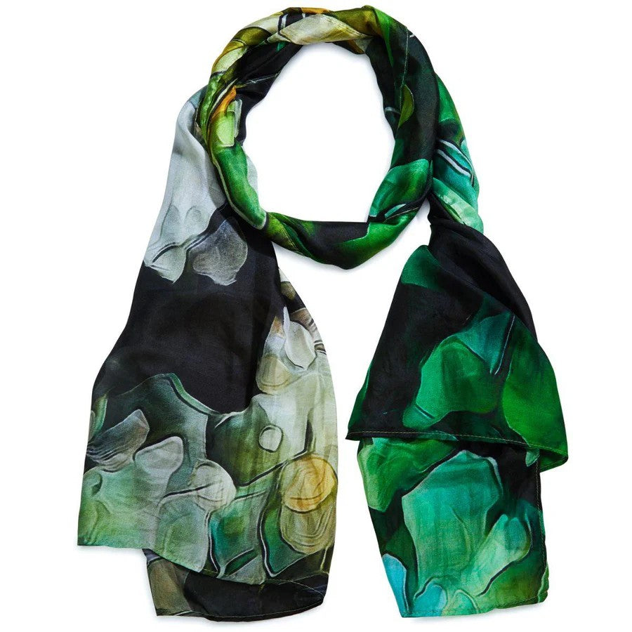 A silk scarf with a floral pattern in vibrant colors