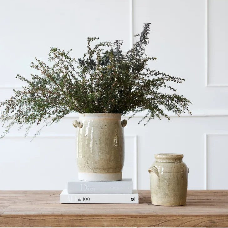 A ceramic terracotta Almada pot with a taupe glaze and cup handles, 