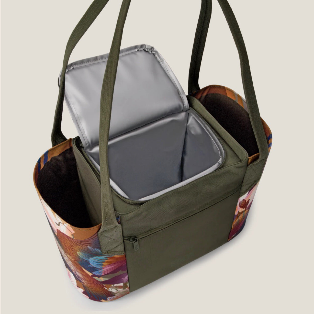 Green tote bag with floral pattern and open compartment showing a cooler inside