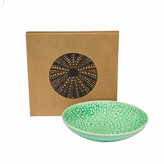 An Aqua ceramic bowl in the formation of a kina