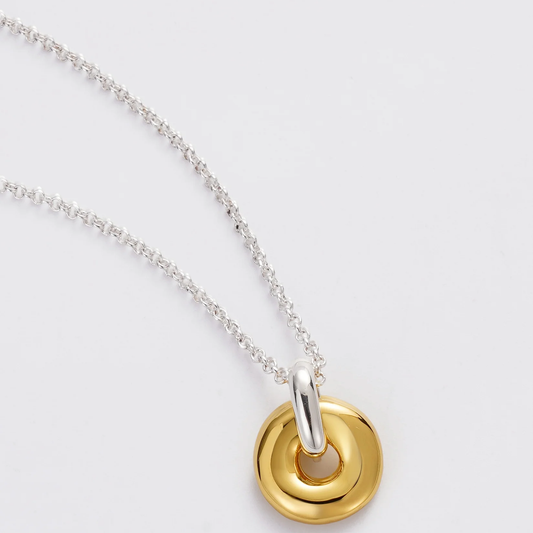 Necklace with a gold and silver pendant