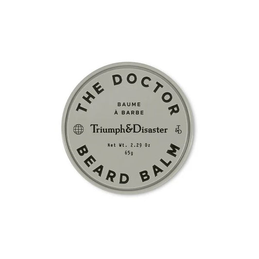 A container of 'The Doctor Beard Balm' by Triumph & Disaster with the product name and weight (65g) displayed on the lid.