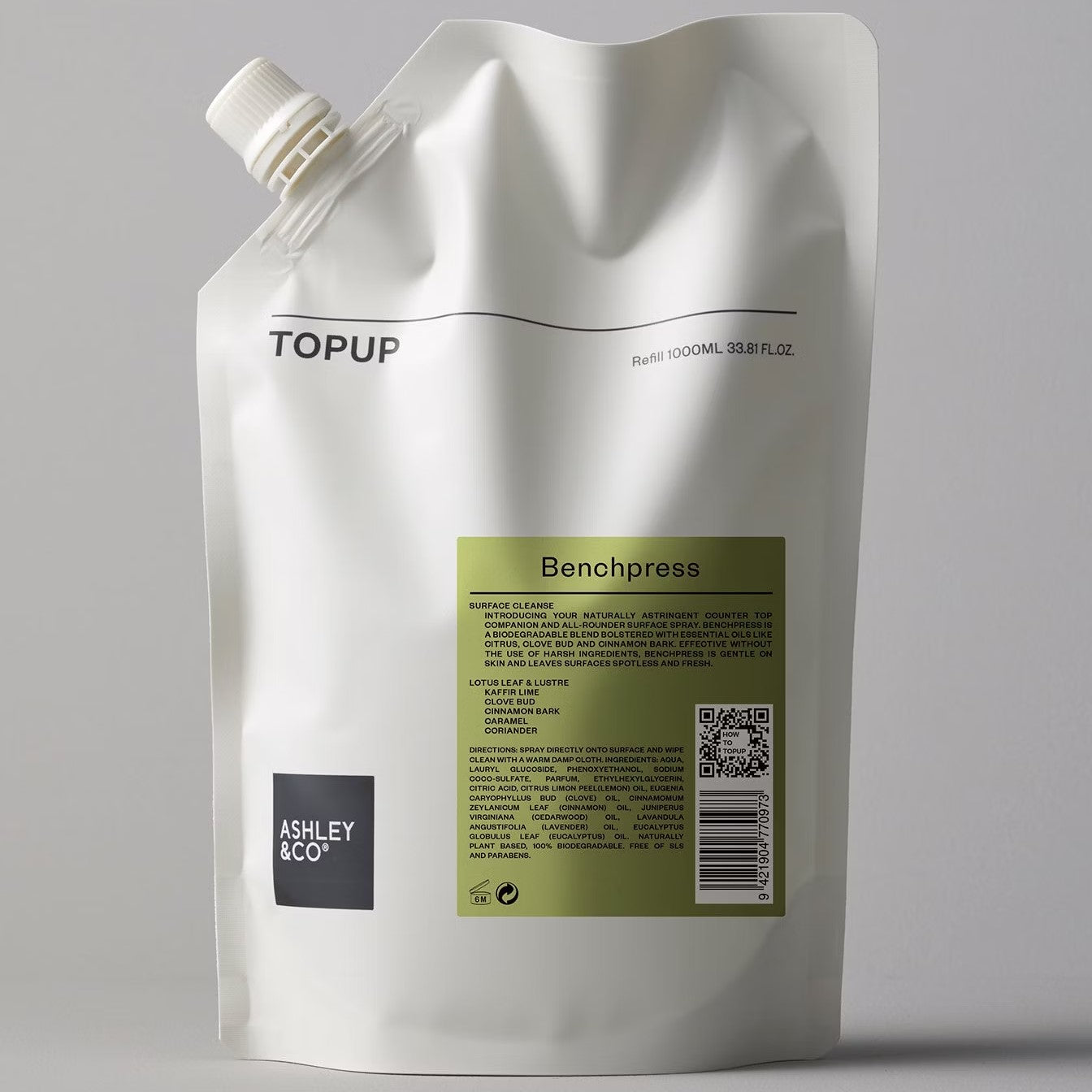 A white paper pouch with a brand logo and product name 'ASHLEY & CO BENCHPRESS' printed on it. The pouch has a capacity of 1000ml and features a resealable lid.