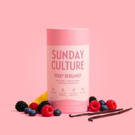 Pink container labeled 'Sunday Culture' with berries and vanilla beans on a pink background