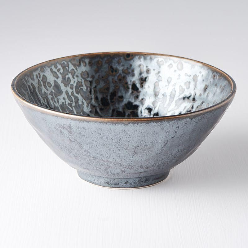 A ceramic Udon bowl with a Black Pearl design, featuring a vibrant splash of gloss black against a matte black background with subtle highlights of cyan.