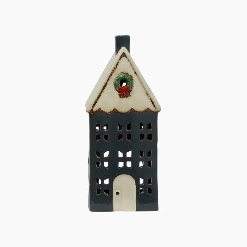 Decorative ceramic house with a wreath
