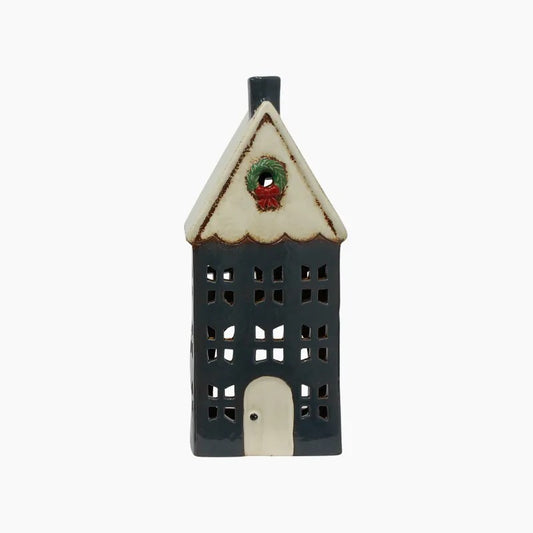 Decorative ceramic house with a wreath