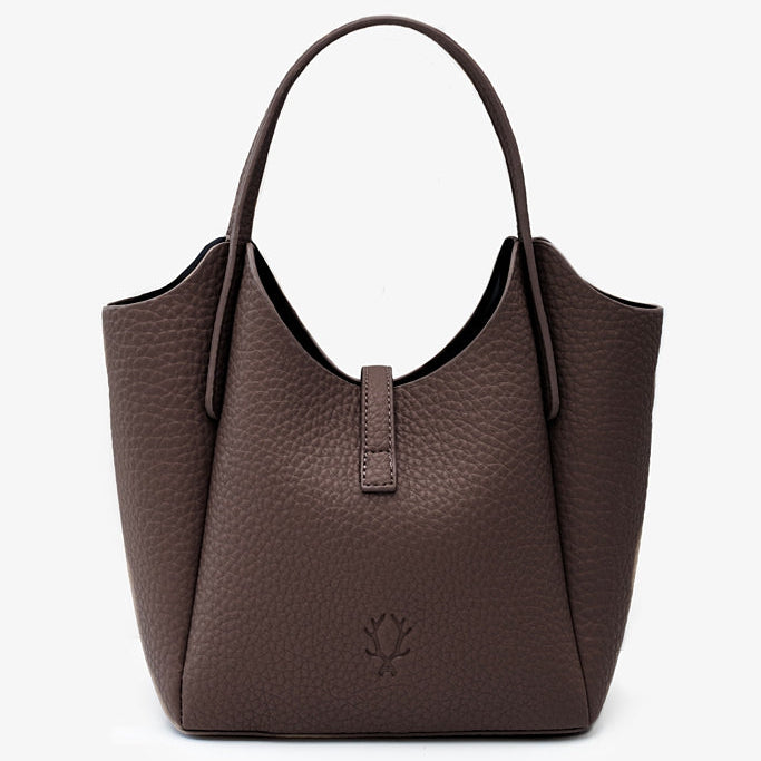 A dark brown pebbled leather hobo-style handbag with double top handles and a small embossed floral logo on the front, 