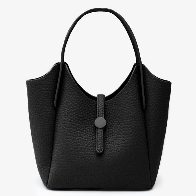A black pebbled leather hobo-style handbag with a single top handle and a front strap detail with a round button, 