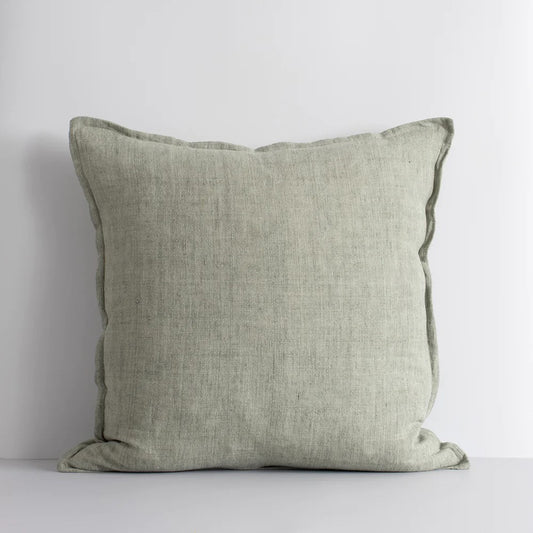 A square-shaped cushion with a flange edge, in a gentle sage green color, made from linen fabric.