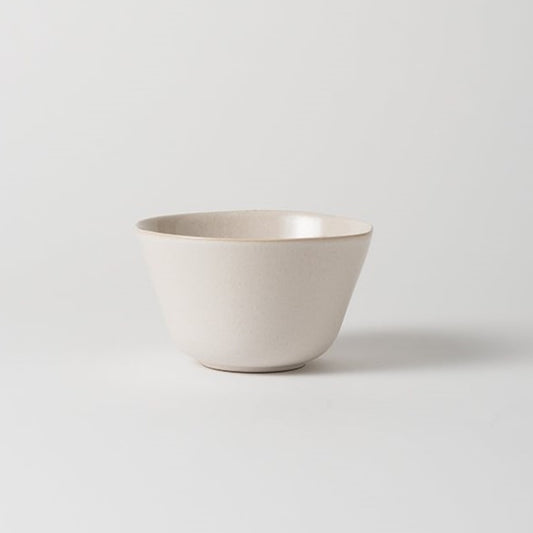 A white ceramic cereal bowl with a subtle natural tone