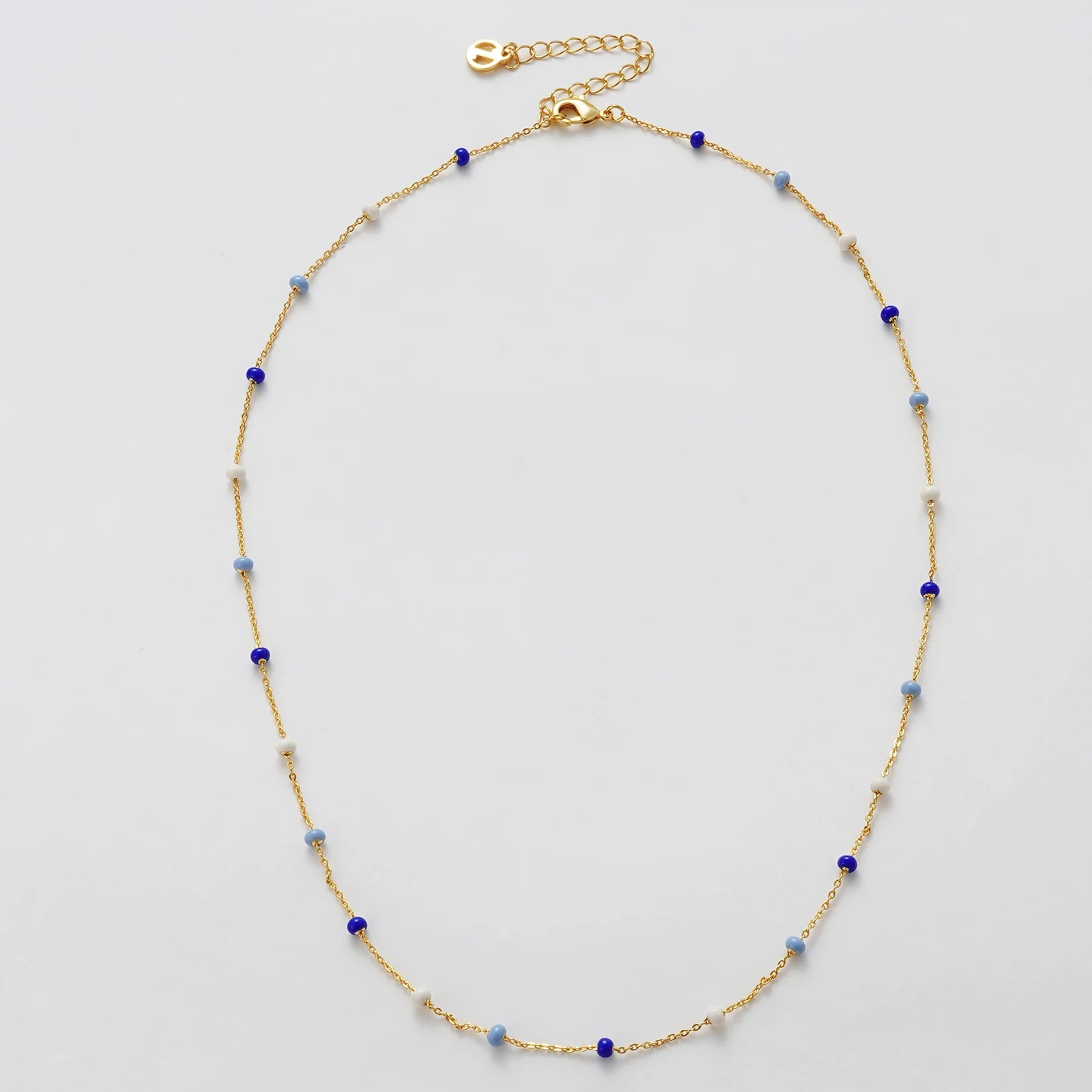 Gold necklace with blue and white beads