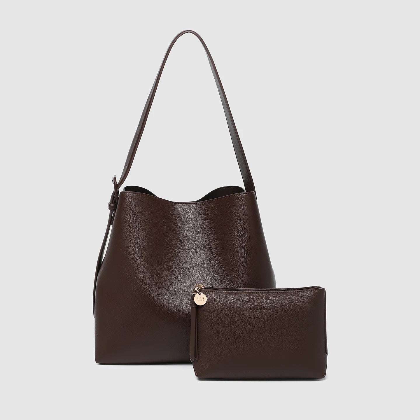 Brown vegan leather handbag with matching pouch on a light gray background
