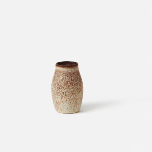 A small ceramic Pod Bud Vase with a brown and beige glaze finish