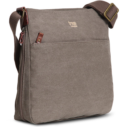 A brown Troop London small zip top shoulder bag with a canvas body and leather trimmings, featuring an adjustable shoulder strap, a secure zip pocket at the back, and a spacious zip pocket on the front.