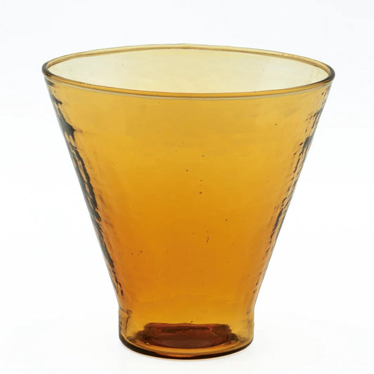 Amber colored hammered glass cocktail glass