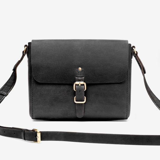 Black leather crossbody bag with gold buckle loyal