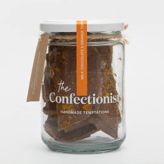 Glass jar filled with chocolate bars labeled 'The Confectionist' on a white background
