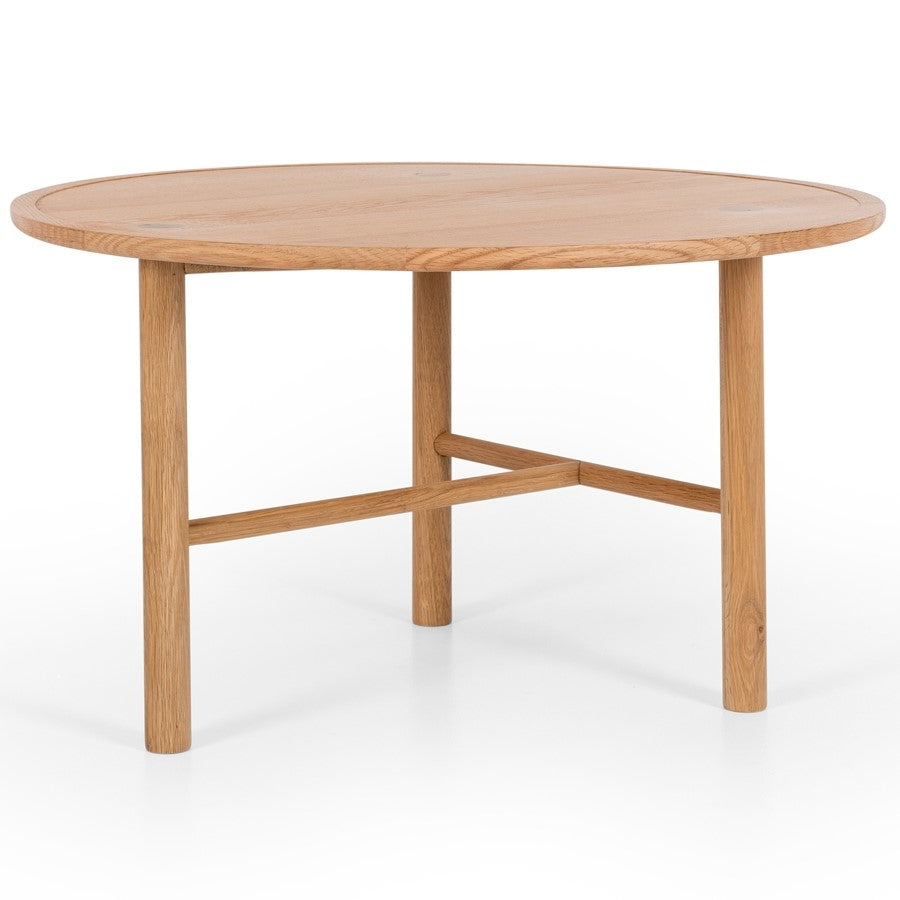 A round oak coffee table with a wood veneer tabletop and solid oak legs.