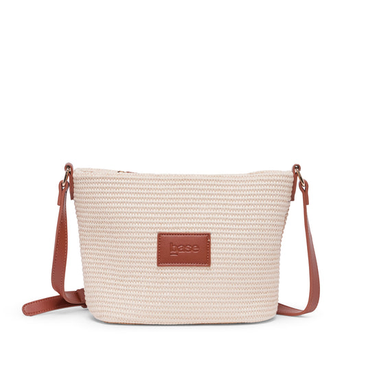Beige straw bag with brown leather patch