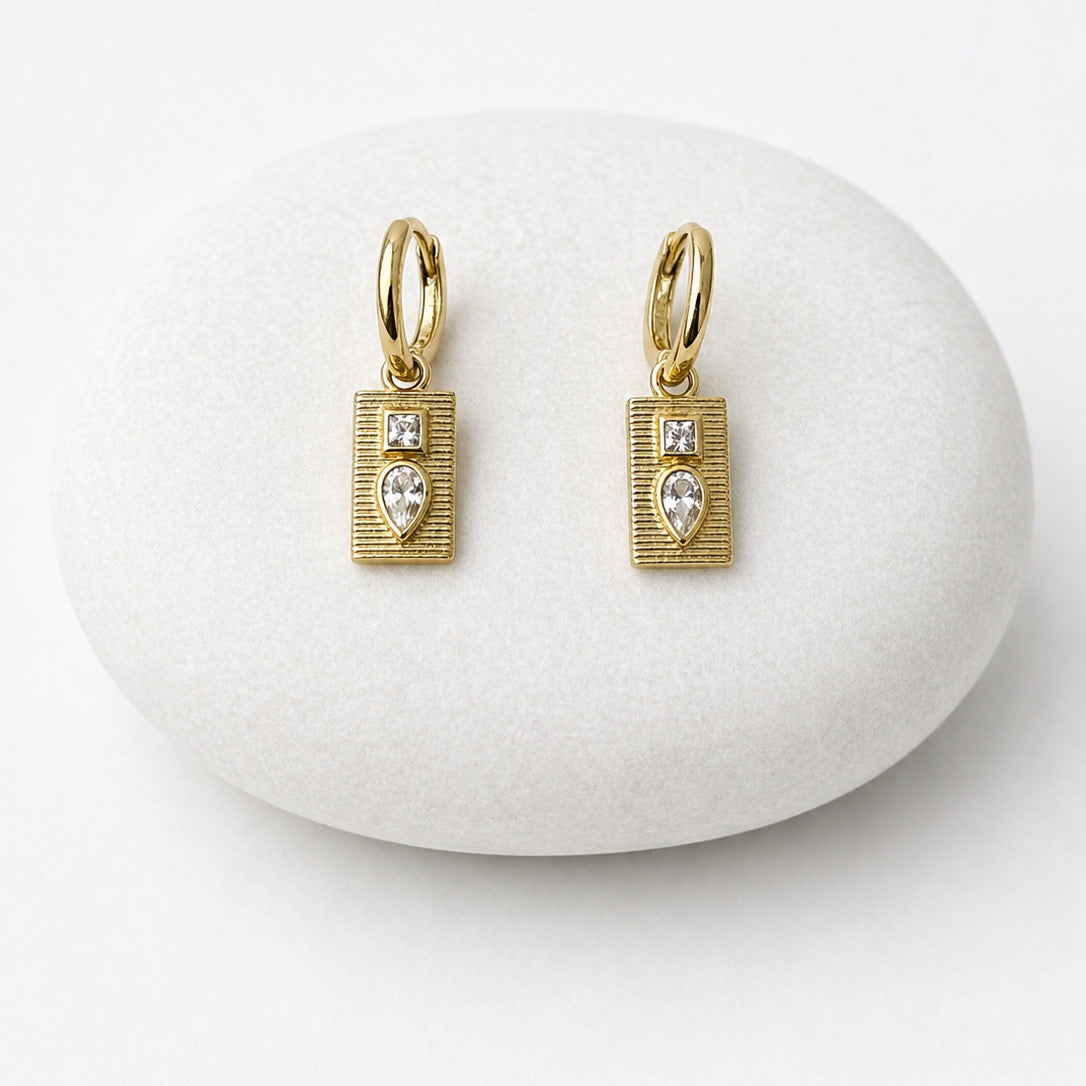 Gold earrings with heart-shaped