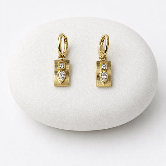 Gold earrings with heart-shaped