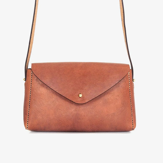 Brown leather handbag with a strap loyal