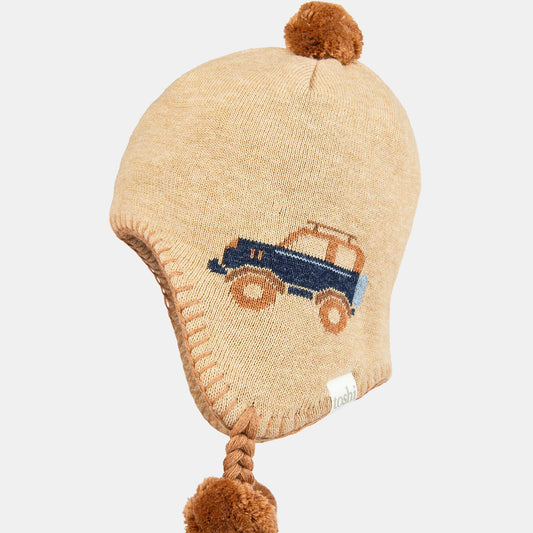 A beige baby earmuff beanie with a blue car design, pom poms, and ear flaps.