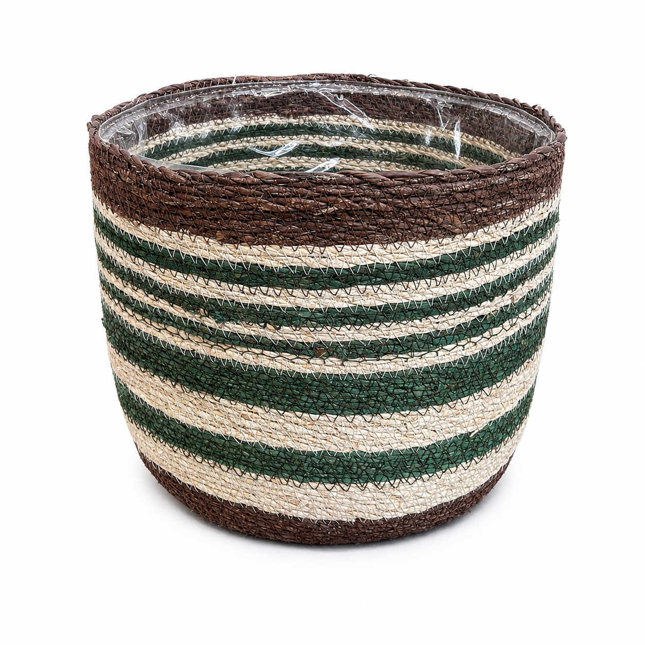 A round woven basket with horizontal stripes in dark brown, natural beige, and forest green, shown on a white background with a clear protective plastic wrap still on the inside.