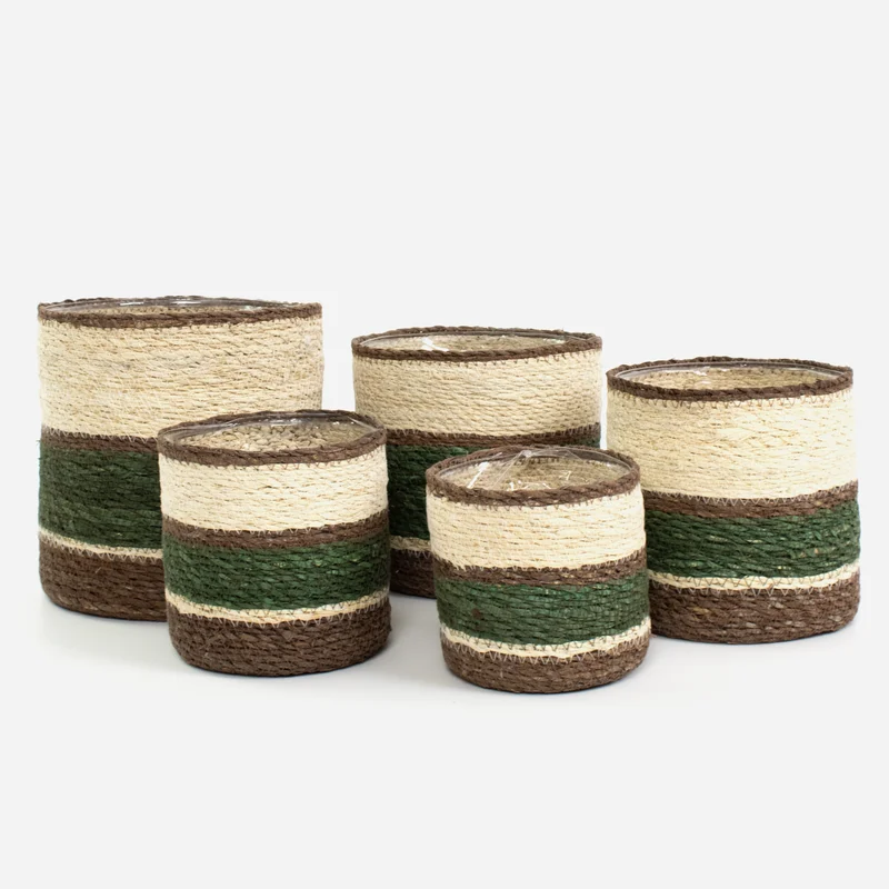 Five woven cylindrical candle holders or vases in graduated sizes, featuring horizontal stripes of natural beige, dark brown, and olive green on a light gray background.